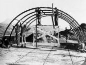 crew assembling quonset hut