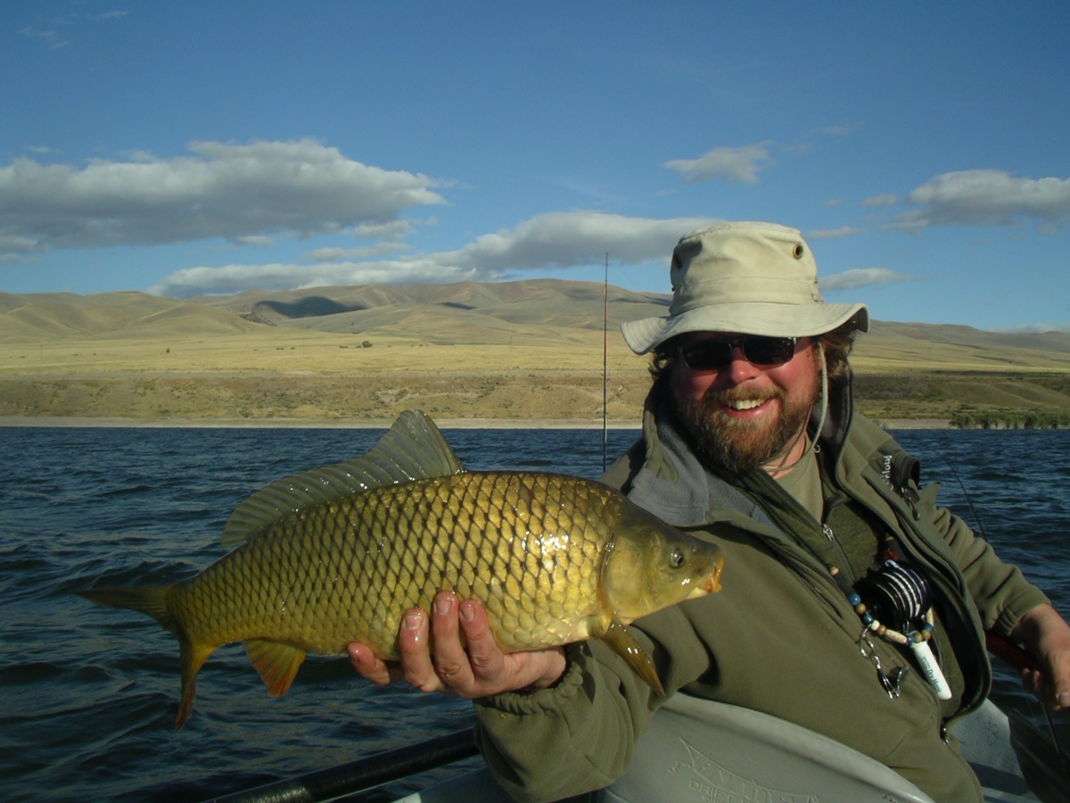 BLM biologist holds carp. BLM photo