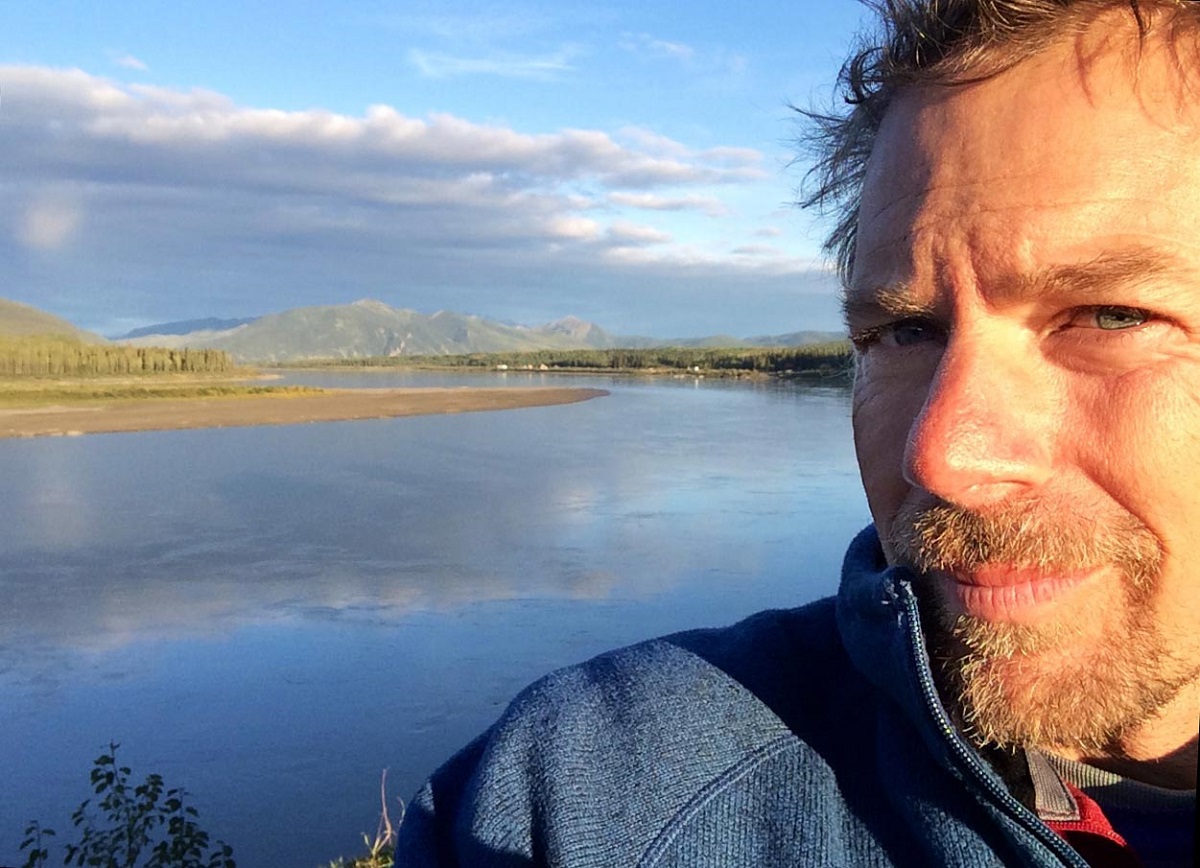 Ned Rozell in front of a landscape.