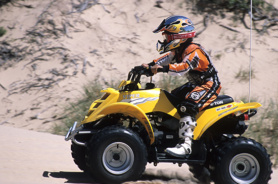 Young rider racing an off-highway vehicle