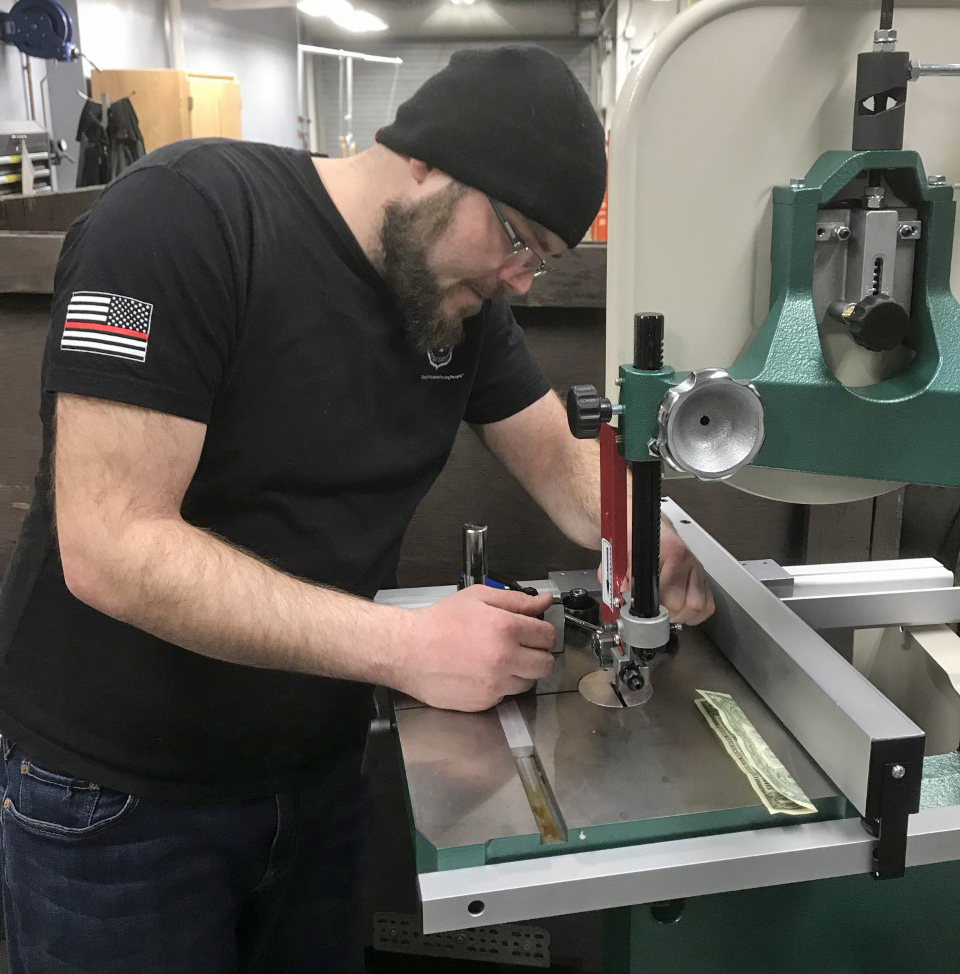 Man working on bandsaw