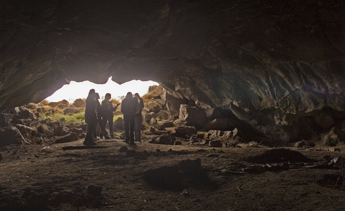 Group stands inside Wilson Butte Cave