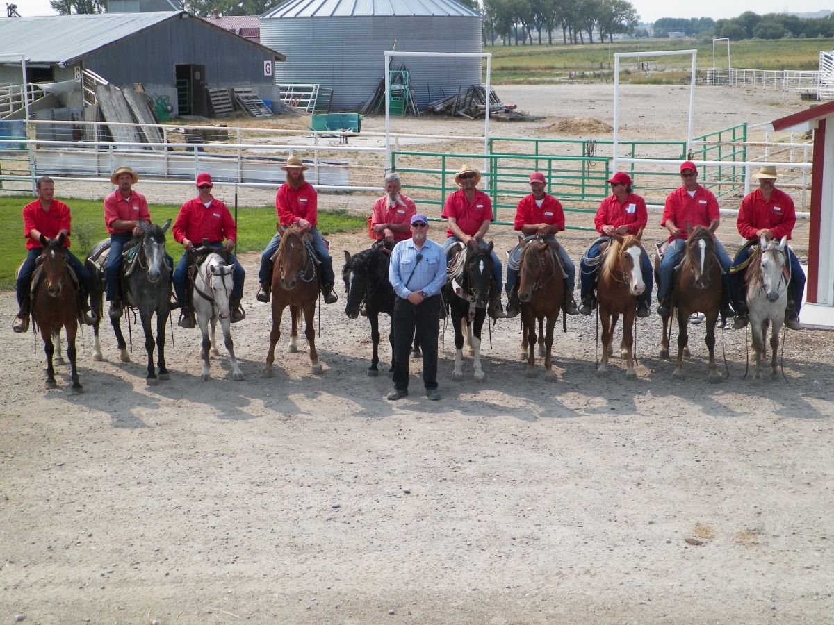 Inmates on their horses in a row. 