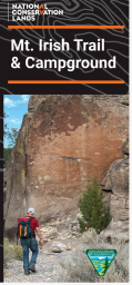 Brochure featuring photo of a hiker in a rocky canyon