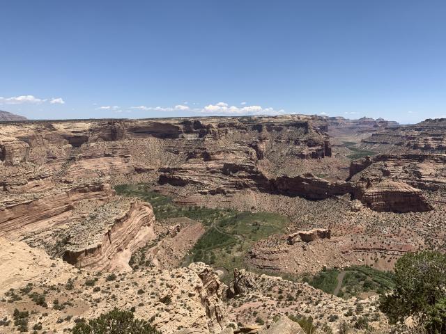 Sids Mountain Wilderness from the popular Wedge Overlook managed by the Price Field Office. The ground is very far below with a river at the base. 