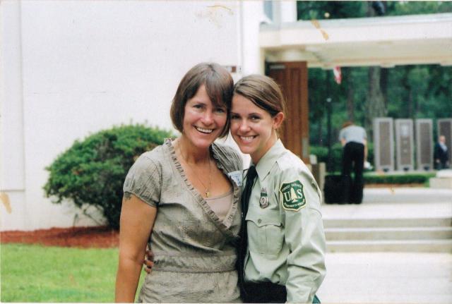 BLM law enforcement ranger stands with her mom on graduation day (prior to role at BLM)