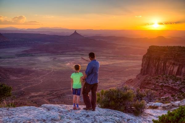 A father and daughter looking over Indian Creek and one of the Six Shooters in Monticello UT FO. Bob says:  "I always like including kids in photos where I can, as they add a message of the future and the importance of considering the future." (Photo by Bob Wick)