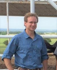 Man standing under overhang