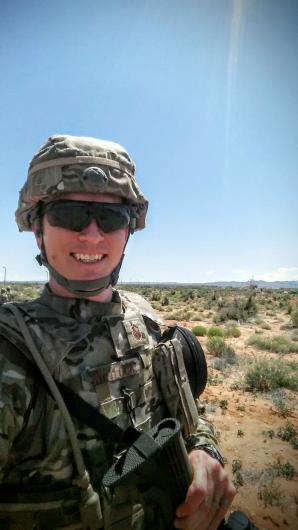 Man in camouflage in desert 