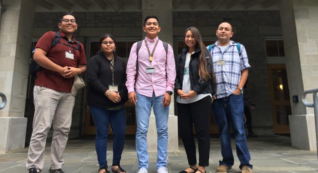 Five NYCALC junior faculty standing in front of a building