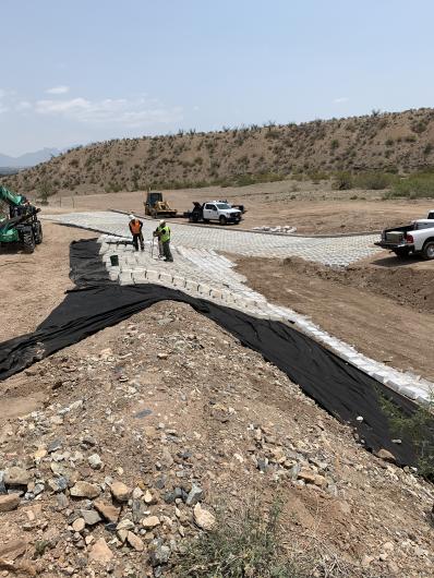 Las Cruces District Force Account crews layout and install articulating mats.