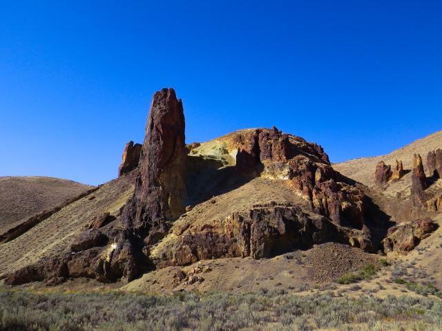 A huge pillar of stone looks like a finger pointing to the sky.