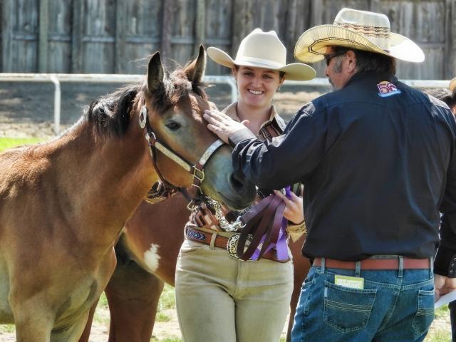 Man and woman with horse.