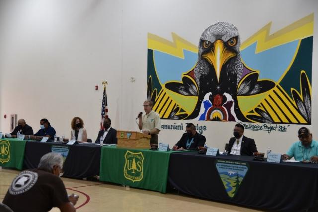 Leaders from Tribes and Agencies at the Bears Ears National Monument Cooperative Agreement Signing Ceremony in front of the mural.