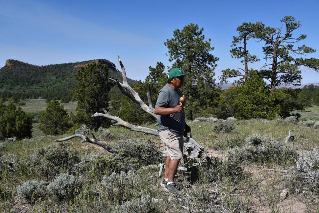 Former Hopi Vice Chairman Clark Tenakhongva preforms an original Hopi song in front of the Bears Ears Buttes.