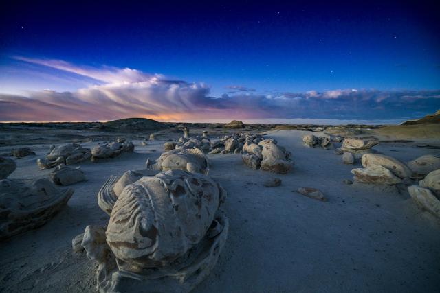 Formations and the horizon in the Bisti/De-Na-Zin Wilderness, located in northwestern New Mexico.