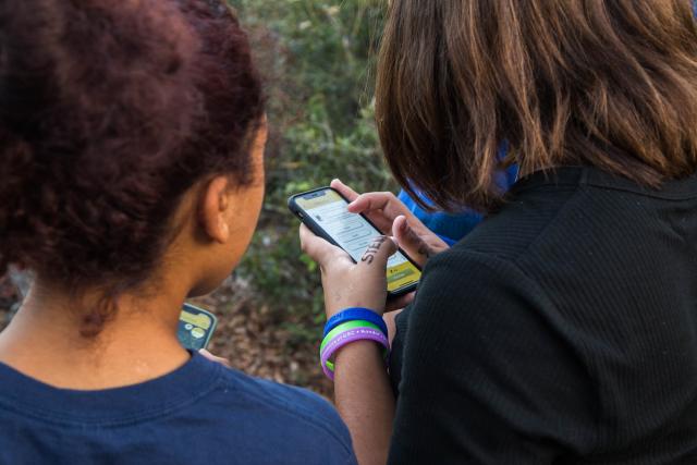 Children playing the Junior Ranger Mission app