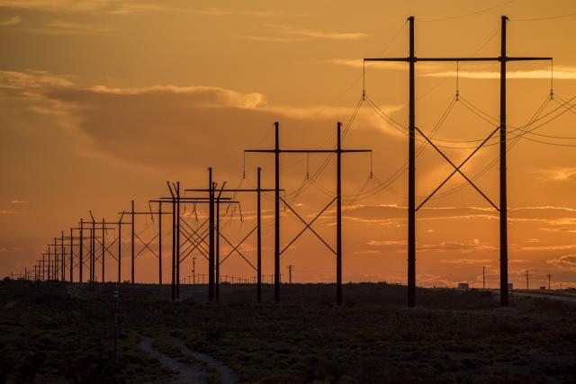 A transmission line at sunset in southern New Mexico.