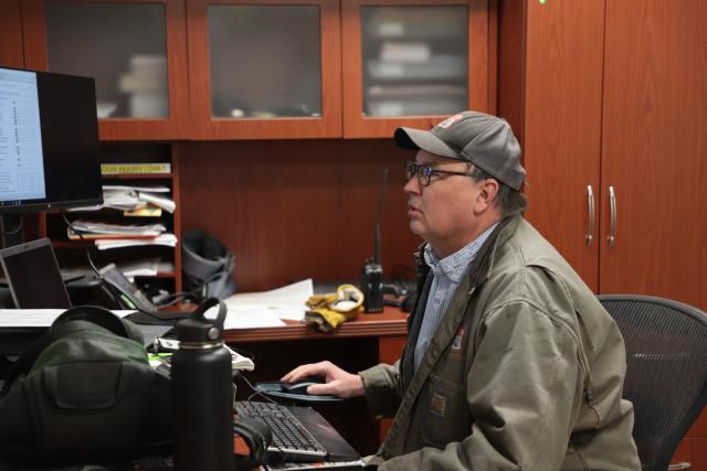 The Bureau of Land Management uses a complex array of sophisticated fire modeling software, detailed scientific weather analysis, and computer wind speed modeling to assess the viability and safety of prescribed fire projects. John Markalunas, the Fire Management Officer of the BLM's Rocky Mountain District, routinely digs into the data as part of the approval process for any proposed fire treatment. (Photo courtesy of the BLM)