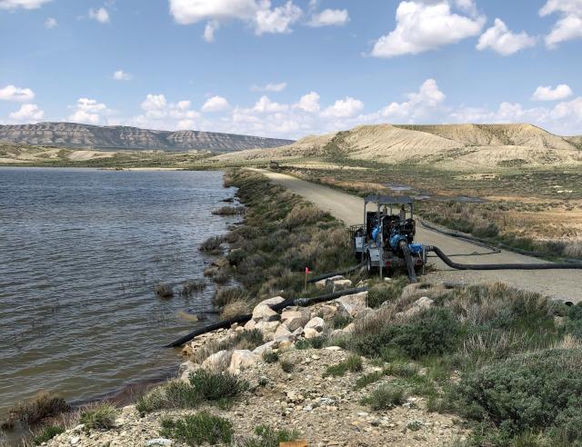 Teton Reservoir Dam with water pump