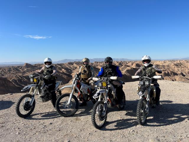 a line of motorcycles with law enforcement officers on them.