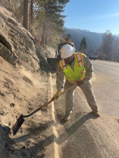 BLM Park Ranger Edgar Castillo works on road improvement project.