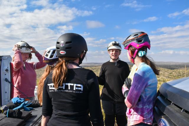 Everis J., center, a Girl Scout Cadette from Troop 10655 in Albuquerque, N.M., gives a safety briefing to other Cadettes before they enter McKittrick Cave near Carlsbad, N.M., Nov. 25.