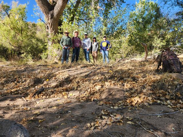 Four people pose for a photo.