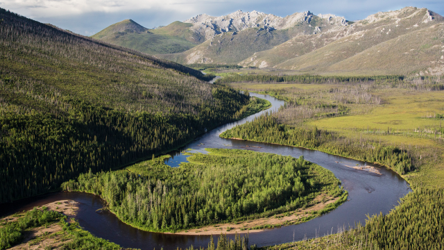 An aerial image of a river winding through mountains