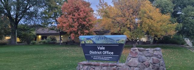 Photo shows an office with a sign in the front identifying it as the Vale District Office. 