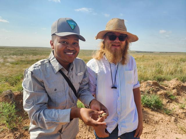 ACE interns Matt Jackson and Connor Stamps pose with a Texas horned lizard.