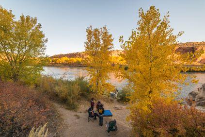 Rafters hangout at a river campsite along the shore of the Colorado River in Ruby-Horsethief Canyons
