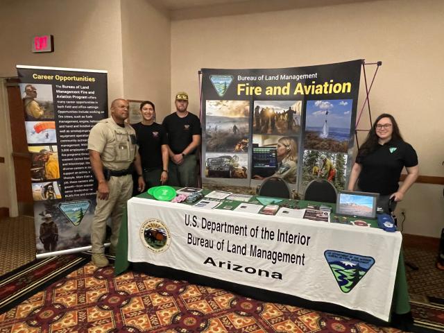 Kaitlin at BLM Job Fair Table on the far right with tree other employees on the left.