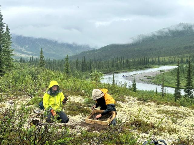 Researchers working on riverbank