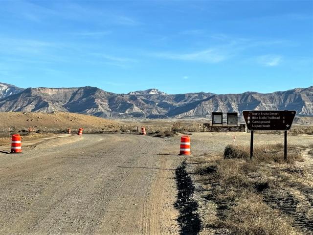 Road construction barrels along road work in North Fruita Desert Special Recreation Management Area