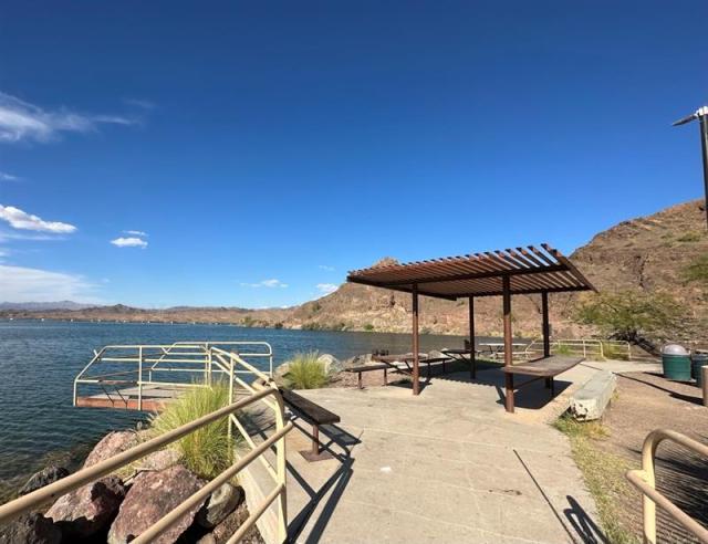 Fishing pier and shade structure for fish cleaning at Take Off Point.