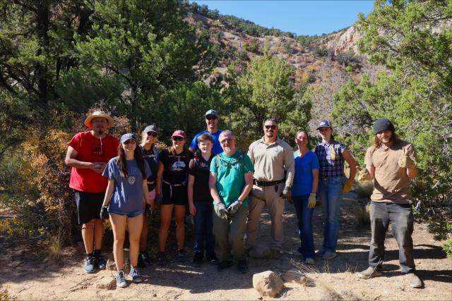 volunteers smile and pose after a clean up project