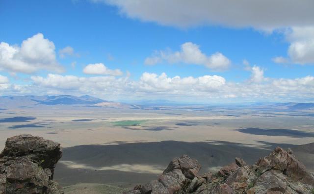 Sweeping vista of open landscape from the view of a rocky outcropping