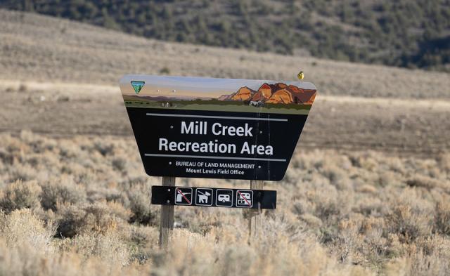 Entrance sign reading Mill Creek Recreation Area among sagebrush.