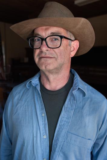 A photo of an archaeologist involved in the Lake Valley ghost town.