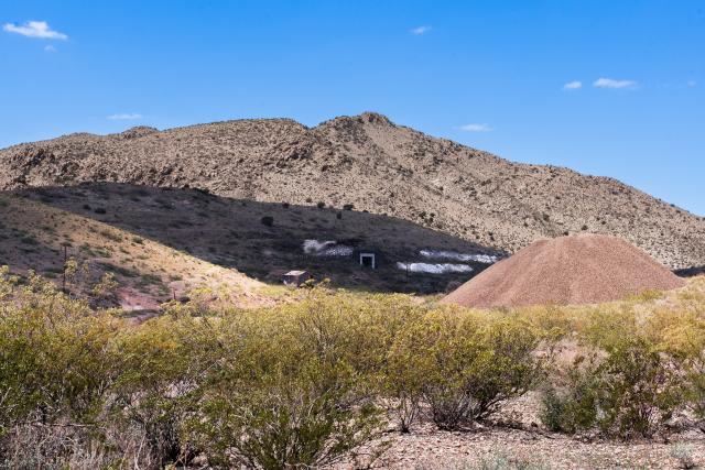 Remnants of mining activity in distant hills.