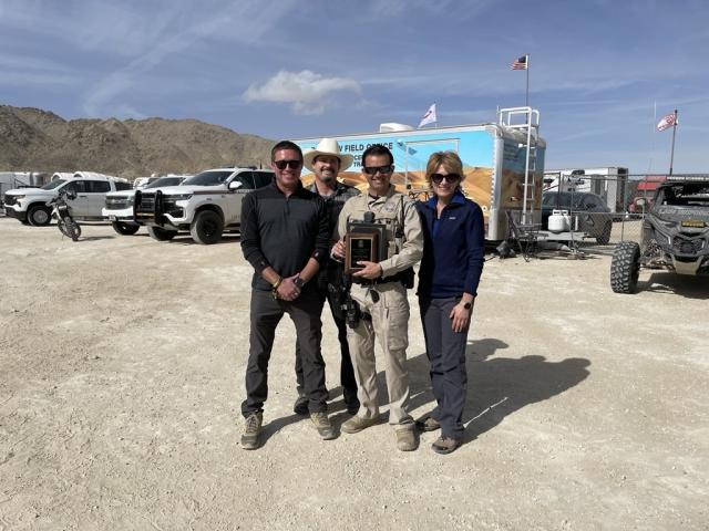 Ranger Cristobal Perez (front center) was recently named the 2024 California Ranger of the Year during a surprise ceremony at King of the Hammers. BLM Photo. 