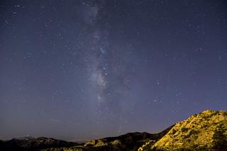 Starry Milky Way with some rocks in the foreground