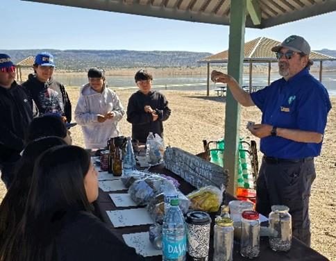 BLM Park Ranger Leon O’Hart teaches a lesson on “Leave No Trace” principles.