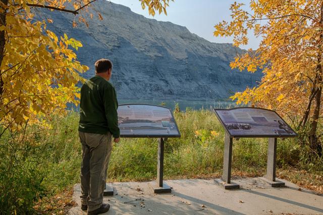visitor reading interpretive signage at Upper Missouri River Breaks National Monument