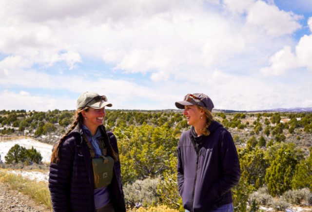 Two women smiling outside