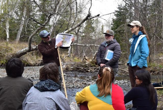 Hydrologists give students a presentation on the basics of hydrology.