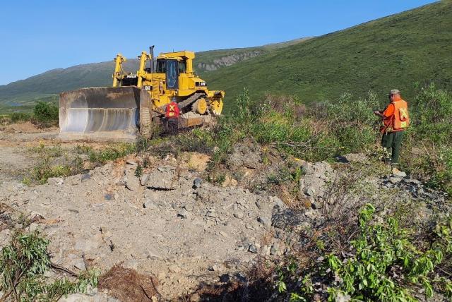 Transburg (right) and environmental protection specialist Justin Burrows (left) document mining activity surface disturbances east of Cantell. Photo by Tony Gallagher (BLM).