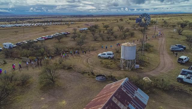 Runners navigate the race course that passes by Empire Ranch structures like a windmill