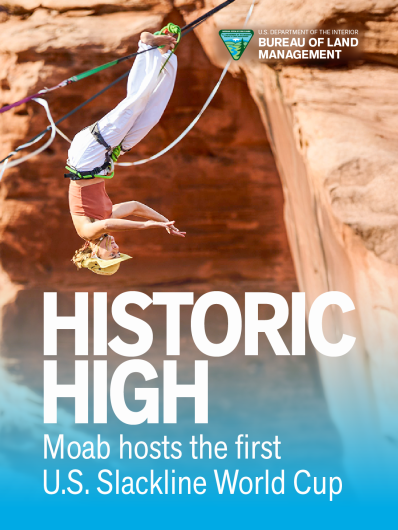 Slackliner upside-down on the line, text reading Historic High, Moab hosts first U.S. Slackline World Cup